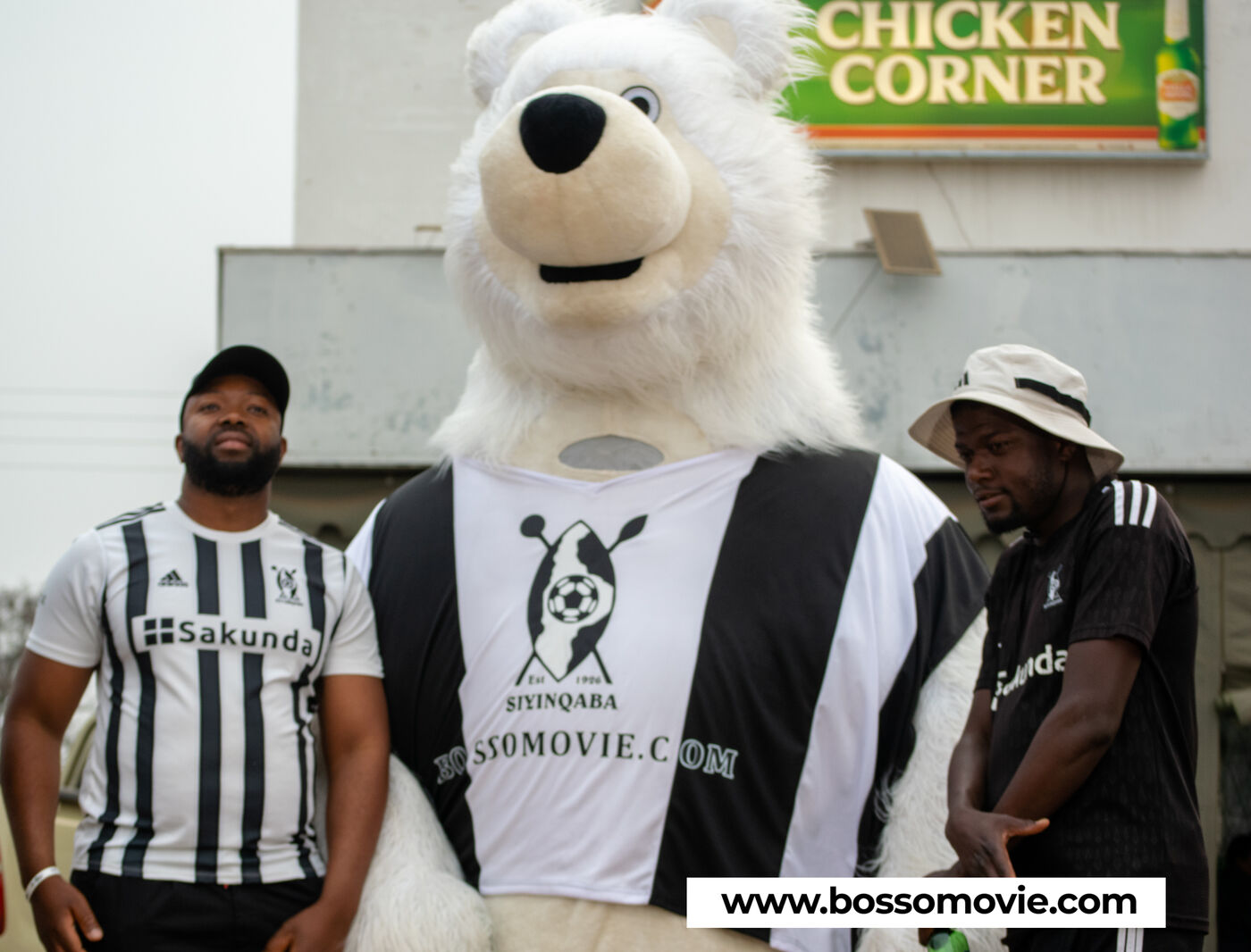 The Bosso Movie mascot with fans outside Chicken Corner in Bulawayo